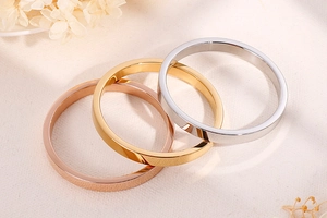 Polished minimalist stainless steel rings in gold, rose gold, and silver finishes