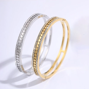 Luxe titanium steel gear bracelets in gold and silver with double row crystal inlay