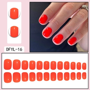 Glossy red press-on nails set including 24 pieces in various sizes for manicure