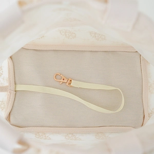 Breathable summer pet carrier bag showing interior canvas texture and safety hook