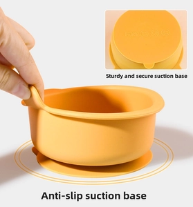 Close-up of baby silicone suction bowl with FDA and BPA free safety markings on base