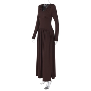 Detail of chocolate brown long sleeve V-neck maxi dress with pleated fabric texture