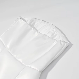 Close-up of elegant white satin strapless dress bodice featuring smooth fabric textures