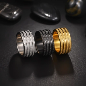 Handcrafted matte brushed men's wedding ring with three grooves in silver, gold, and black