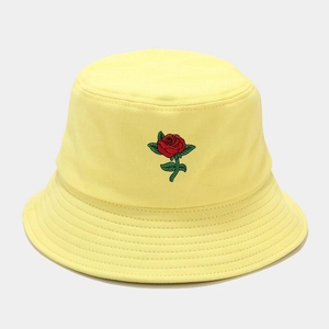 Yellow cotton bucket hat with rose embroidery detail and a casual sun protection style