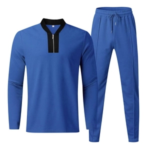Detail of waffle-knit fabric on royal blue men's leisure tracksuit with quarter-zip neckline