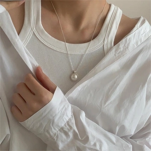 Elegant 925 sterling silver necklace featuring a lustrous round white pearl pendant