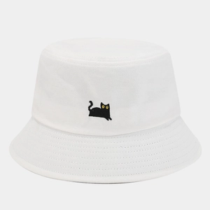 Close-up of cute black cat embroidery on a white cotton bucket hat with fine stitching