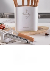 Close-up of silicone kitchen utensils with wooden handles in a cream storage bucket