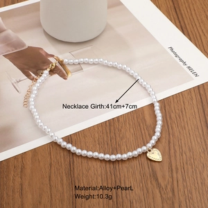 Elegant gold heart pendant necklace with white pearls and adjustable alloy chain