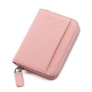 Detail of pink lychee grain leather card holder with silver metal zipper and side pocket