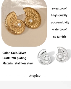 Macro detail of French retro conch shell earrings with PVD gold and silver finish