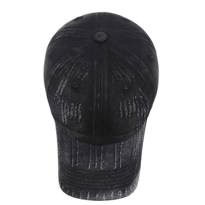 Distressed black denim baseball cap with vintage ripped details and streetwear wash style