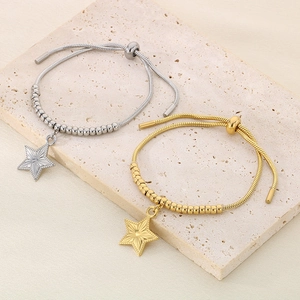 Adjustable beaded star charm bracelet in gold and silver finish with snake chain