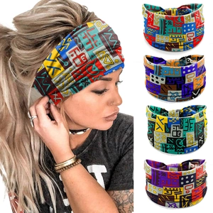Detail of four colorful geometric print headbands showing elastic fabric and knot design