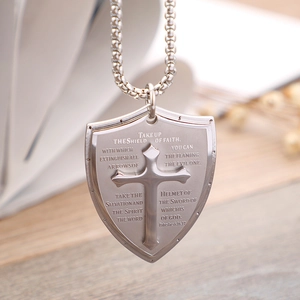Silver stainless steel shield necklace featuring cross pattern and engraved scripture