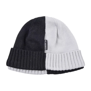 Detail of color-block knit beanie with black and grey contrast and brand logo label