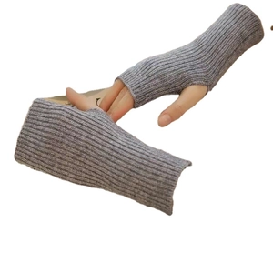 Pair of gray knitted fingerless gloves for winter with a thick textured wool finish