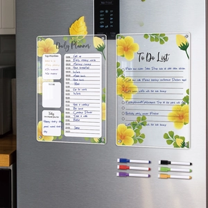 Detail of magnetic acrylic daily planner and to-do list with floral patterns on fridge