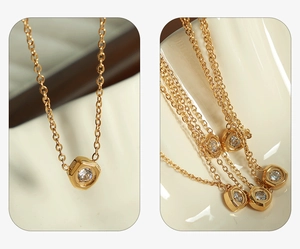 Macro detail of hexagonal gold pendant with sparkling zircon on a refined chain