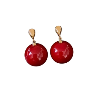 Exquisite red strawberry drop earrings with gold hooks on a clean white background