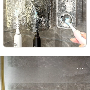Detail of wall-mounted wash set with wave-textured cups and automatic toothpaste squeezer