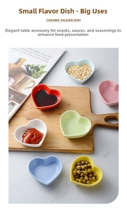 Close-up of heart-shaped ceramic dipping dishes in six vibrant colors on marble