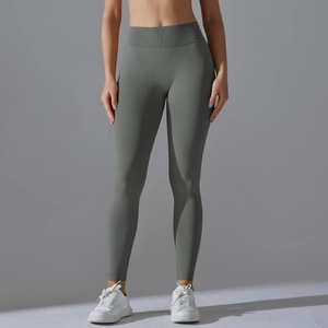 Detailed view of seamless ribbed high-waist band on dark grey yoga leggings for tummy control