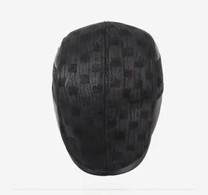Top view showing textured jacquard fabric and black leather brim of the baseball cap