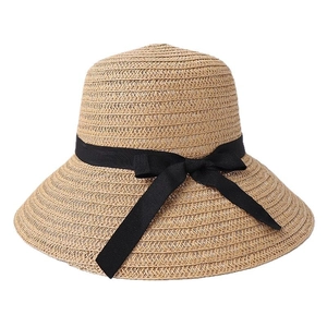 Women's wide brim straw sun hat with black ribbon bow decoration for beach travel