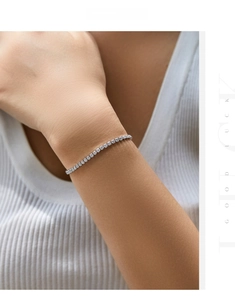 Close-up of sparkling S925 sterling silver tennis bracelet with cubic zirconia on wrist