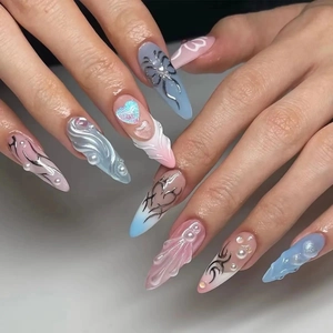 Y2K style long stiletto press-on nails with blue pink gradient and 3D metallic silver details