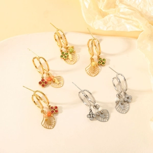 Detailed shot of multi-color gemstone flower earrings with hollow gold and silver pendants