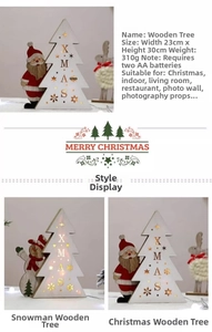 Close-up of wooden Xmas tree light with 23x30cm dimensions and built-in LED warm glow