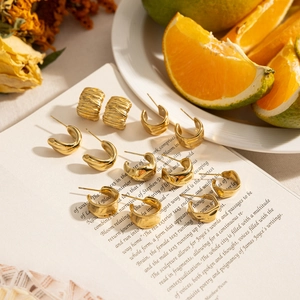Chic 14K gold plated irregular C-shape titanium steel earrings set on vintage book pages