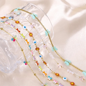 Gold-plated necklace set with colorful enamel butterflies and pearls on silk