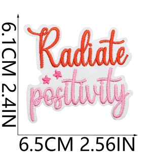 Detailed view of Radiate Positivity embroidery patch with size markers 6.1x6.5cm