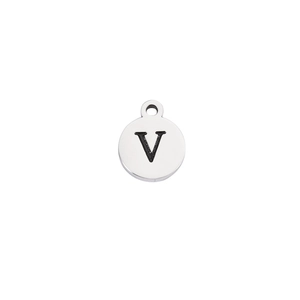Macro shot of polished stainless steel round pendant featuring a black engraved letter V