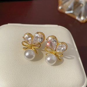 Elegant gold butterfly bow earrings with zircon heart wings and round pearls