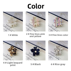 Detailed grid view of floral hair claws in six colors with pearl center embellishments