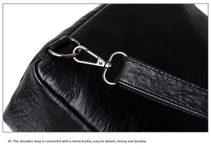 Close-up of litchi grain leather texture and silver metal buckle on black backpack