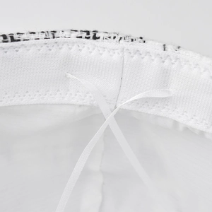 Detail of white sweatband and adjustable drawstring inside the tweed baker boy hat