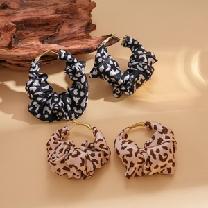 Leopard print fabric hoop earrings in black, white, and brown beige with gold accents