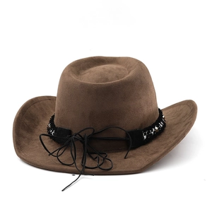 Detail of dark brown suede cowboy hat with braided black band and silver metal accents