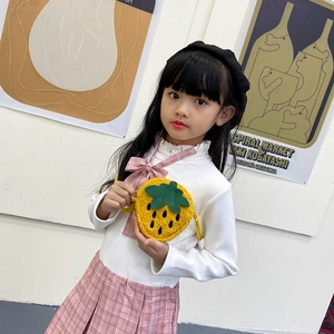 Cute yellow plush strawberry crossbody bag for girls with green leaf detail and thin strap
