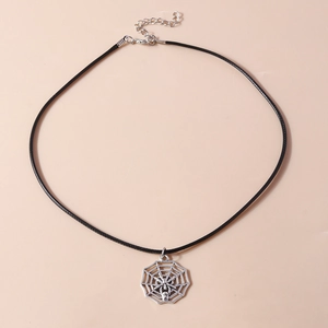 Detail of silver spider web pendant and black cord necklace with lobster clasp