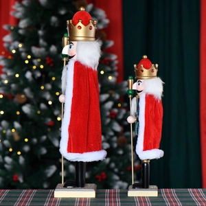 European Christmas nutcracker king figures with red cloaks and green plaid decoration