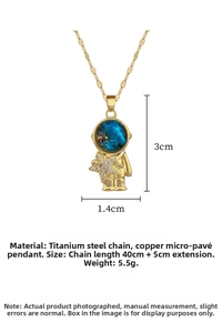 Macro shot of astronaut pendant with blue starry helmet and sparkling star details