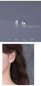 Macro detail of S999 silver musical note stud earrings with dimensions and model display