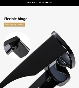Close-up of flexible metal hinge and glossy black frame detail on stylish sunglasses